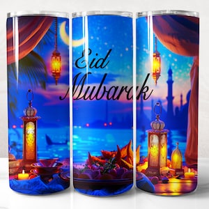 May include: A stainless steel tumbler with a colorful image of a night scene with lanterns, a crescent moon, and the text "Eid Mubarak".