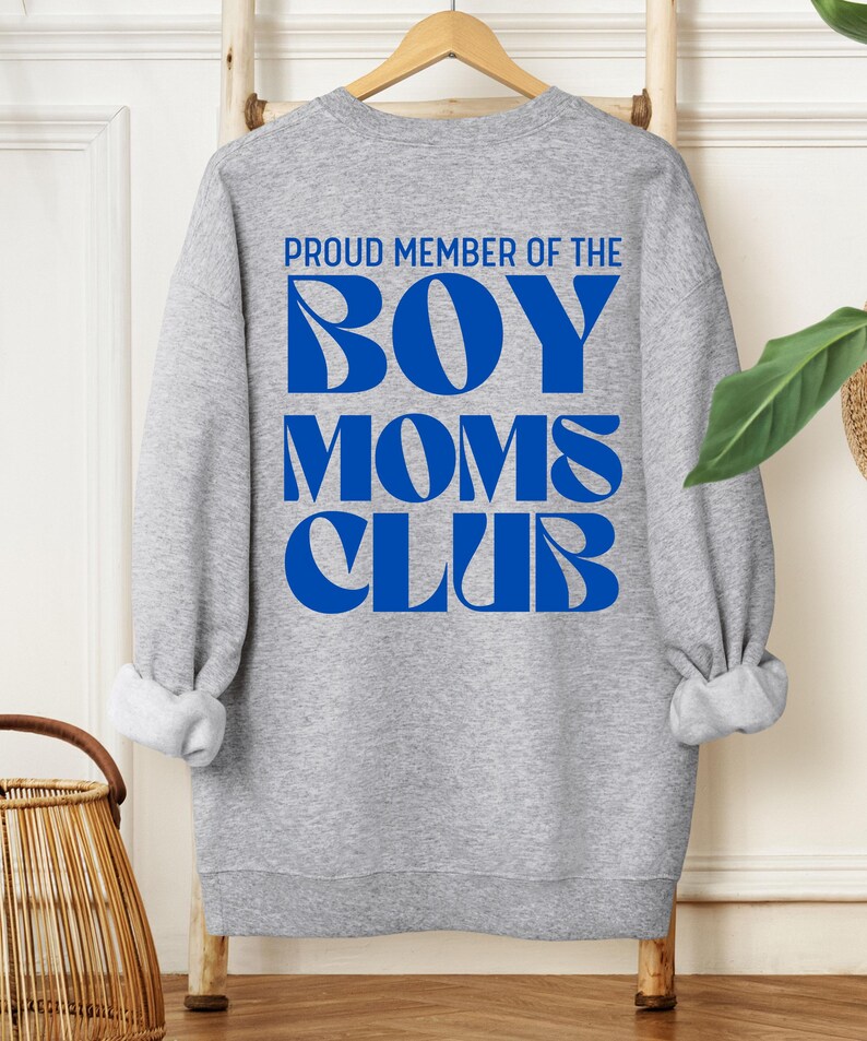 May include: Gray sweatshirt with blue text that reads "Proud Member of the Boy Moms Club".