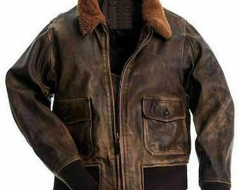 May include: A brown leather bomber jacket with a shearling collar and zipper closure. The jacket has two flap pockets on the front and a ribbed knit collar, cuffs, and hem.