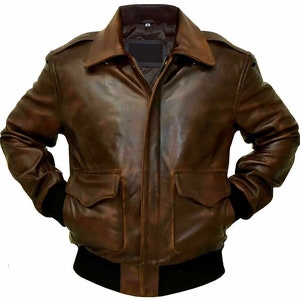 May include: A brown leather bomber jacket with a zipper closure and two flap pockets. The jacket has a ribbed knit collar, cuffs, and waistband.