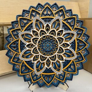 This is my 7 layer 19.5" Snowflake Mandala. With the color pattern "midnight"