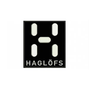 Puede incluir: Logotipo cuadrado negro con la palabra "HAGLÖFS" en texto blanco en la parte inferior. El logotipo presenta un diseño en forma de H blanco en el centro, compuesto por cuatro óvalos verticales y un óvalo horizontal.