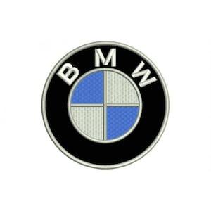May include: A black and white circular logo with the letters "BMW" in white around the edge. The centre of the logo is a blue and white propeller design.