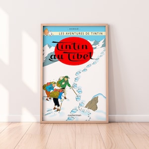 May include: A vintage comic book cover featuring Tintin, a young reporter, and his dog Snowy, in the Himalayas. The cover is titled "Tintin au Tibet" and features a red circle with white text. The cover is framed in a wooden frame.