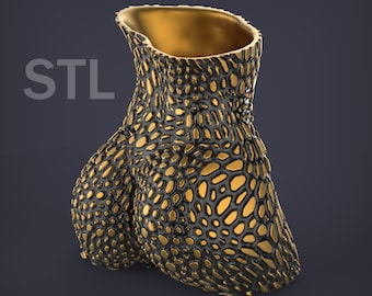 May include: A gold-colored vase with a textured surface resembling scales. The vase has a wide opening at the top and a rounded, organic shape.