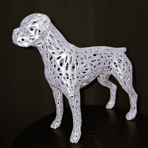 May include: White 3D printed dog sculpture with a detailed, intricate, lattice-like design. The sculpture is of a dog standing on all four legs.