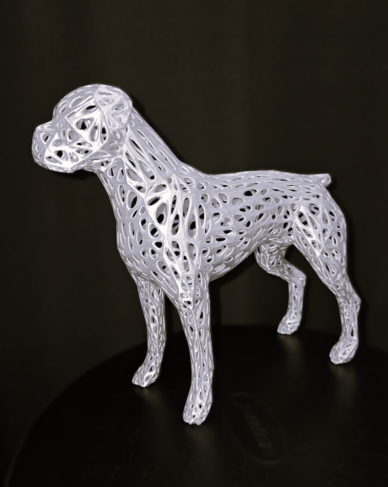 May include: White 3D printed dog sculpture with a detailed, intricate, lattice-like design. The sculpture is of a dog standing on all four legs.
