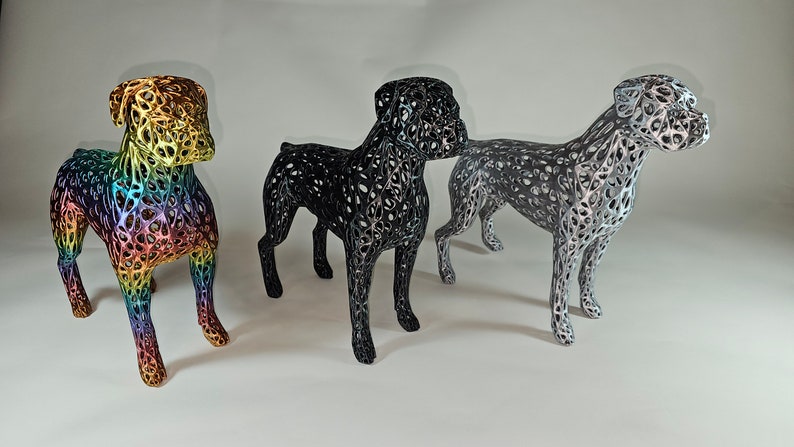 May include: Three wireframe sculptures of a boxer dog, each in a different color: rainbow, black, and silver.