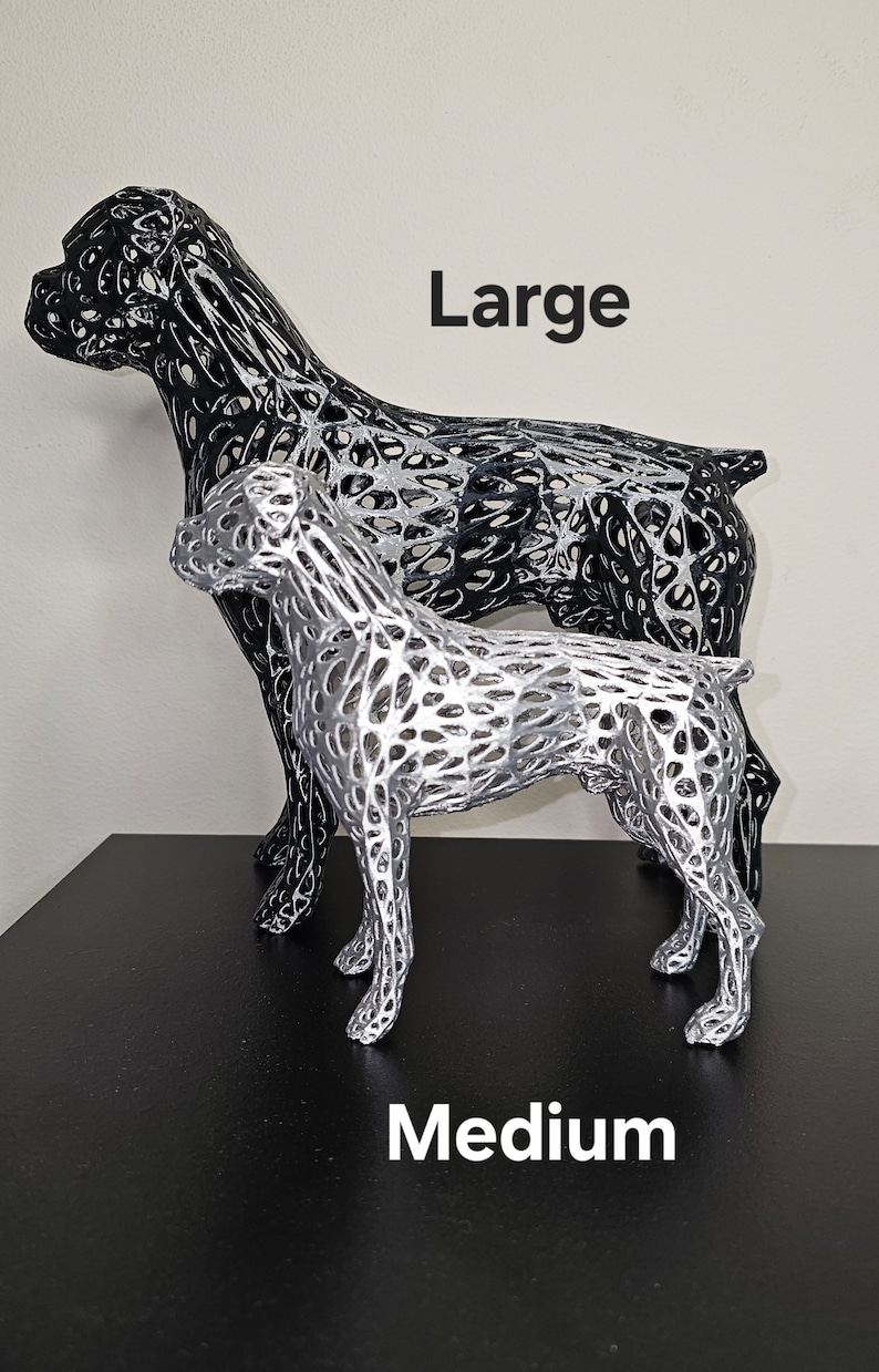 May include: Two wireframe dog sculptures, one large and one medium, in black and silver finishes. The sculptures are posed in a standing position. The text "Large" and "Medium" are printed below the sculptures.