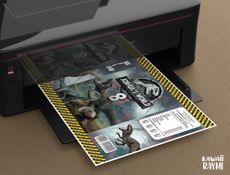 May include: A black and yellow Jurassic World themed printable party favor box with the text "Joshua's World" and the number "8" printed on the front. The box is being printed on a black printer.