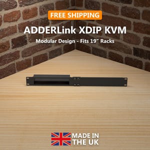 May include: A black ADDERLink XDIP KVM, designed for 19-inch racks, is displayed on a wooden surface. The image includes the text "FREE SHIPPING" and "MADE IN THE UK". The KVM has a modular design.