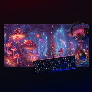 May include: A colorful gaming mouse pad with a fantasy forest scene featuring glowing mushrooms and trees. A black keyboard and a black gaming mouse are on the pad.