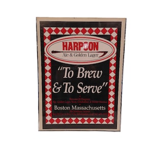 May include: A black and red sign with the text "HARPOON Ale & Golden Lager" and the slogan "To Brew & To Serve". The sign also includes the text "Boston Massachusetts".
