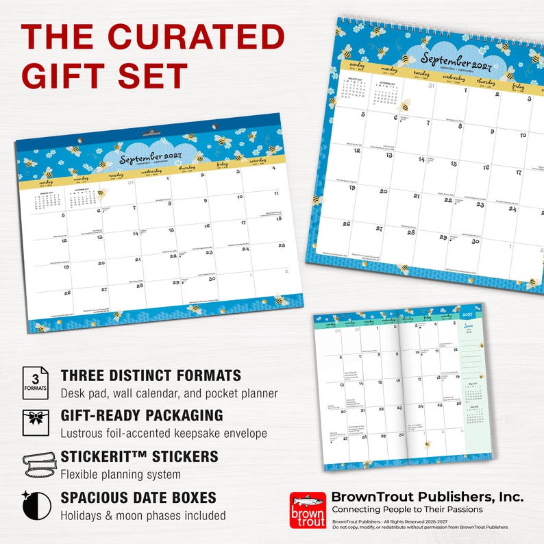 May include: A curated gift set featuring a desk pad, wall calendar, and pocket planner for September 2027. Each item displays a blue background with yellow and black bee illustrations. The set includes sticker sheets and a foil-accented envelope.