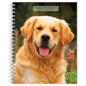 May include: A spiral-bound planner featuring a golden retriever on the cover with the text Golden Retrievers 2027 16-month planner. The dog has light golden fur, a black nose, and an open mouth with a pink tongue visible against a blurred background.