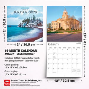 May include: A 16-month wall calendar for 2027 titled Minnesota Land of 10,000 Lakes. It measures 12 inches by 12 inches closed and 12 inches by 24 inches open. The calendar features a snowy landscape cover and a March page with a building photograph.