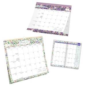 May include: Three paper calendars featuring floral patterns in shades of purple, green, and pink. One large wall calendar displays March 2027, another shows a different month with a purple floral border, and a small planner shows January 2027.