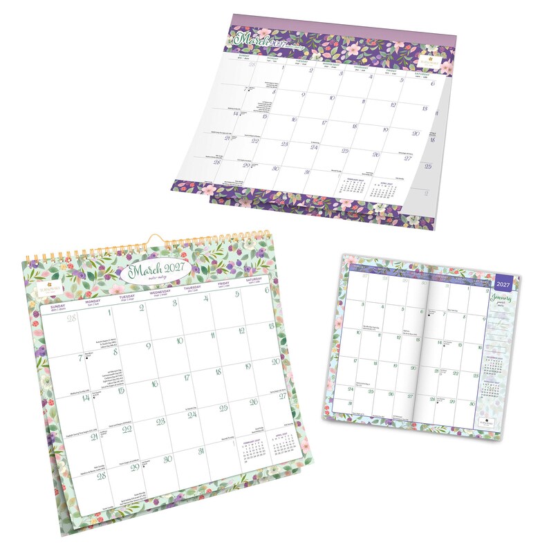 May include: Three paper calendars featuring floral patterns in shades of purple, green, and pink. One large wall calendar displays March 2027, another shows a different month with a purple floral border, and a small planner shows January 2027.