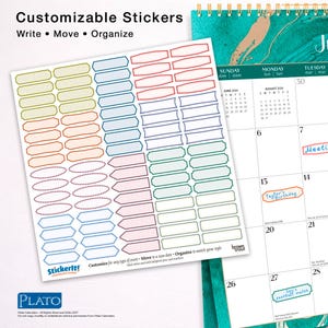 May include: A sheet of customizable stickers with various shapes and colors, including rectangles and ovals. The text on the sheet reads "Write, Move, Organize." A calendar is visible in the background, with the text "June 2026" and "August 2026."