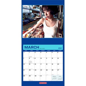 May include: A 2027 wall calendar for the month of March featuring a photograph of a person with short dark hair wearing a white ribbed tank top. The calendar grid displays the days of the month with the text MARCH 2027 and LE SSERAFIM at the bottom.
