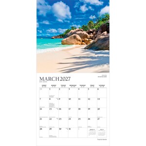May include: A wall calendar for March 2027 featuring a photograph of a tropical beach with white sand, turquoise water, and large granite boulders under a blue sky with clouds. The calendar grid displays the days of the month in black text.