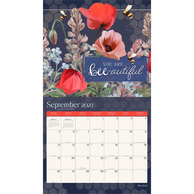 May include: A wall calendar for September 2021 featuring a dark blue background with a honeycomb pattern. The top section displays red and pink poppies, blue flowers, and bees. A blue rectangular box contains the white text, You are bee-autiful.