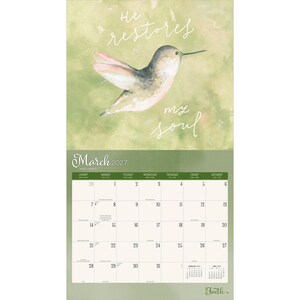 May include: A 2027 wall calendar for the month of March featuring a watercolour illustration of a hummingbird against a soft green background. The text "He restores my soul" is written in white script above the bird. The calendar grid shows dates.