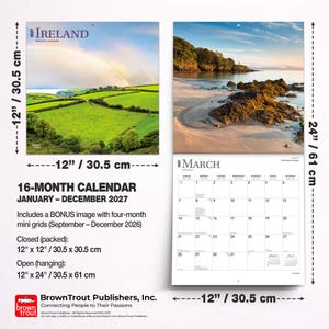 May include: A 2027 Ireland 16-month calendar measuring 12 inches by 12 inches closed and 12 inches by 24 inches open. The cover features a green landscape with a rainbow, while the interior shows a coastal scene and a March grid for 2027.