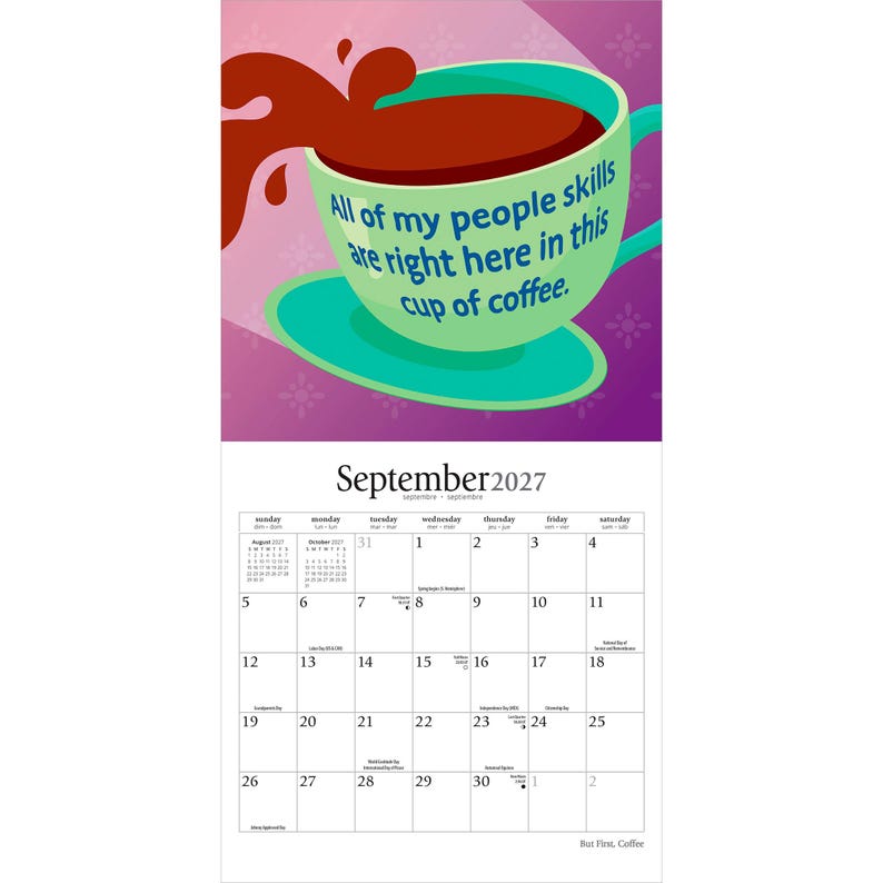 May include: A wall calendar for September 2027 featuring a graphic illustration of a teal coffee cup with dark brown liquid splashing out. The cup displays the text: All of my people skills are right here in this cup of coffee. The calendar grid is white.