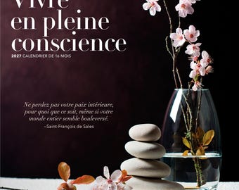 May include: A 2027 16-month calendar titled Vivre en pleine conscience. The cover features a clear glass vase with pink cherry blossoms, a stack of four smooth light gray stones, and a quote by Saint-François de Sales on a dark background.