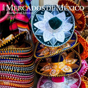 May include: A calendar titled "Mercados de M&eacute;xico" with a stack of colorful sombreros. The sombreros are in various colors, including black, blue, red, and green, with intricate embroidery and gold trim. The calendar also includes the text "Markets of Mexico" and "16-Month Calendar."