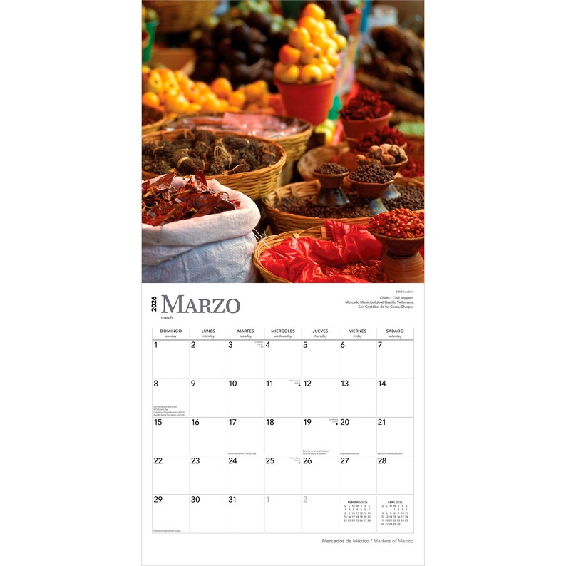 May include: A calendar page for March 2026 featuring a vibrant market scene. Baskets and containers are filled with colorful produce, including red peppers, yellow fruits, and various spices. The word "MARZO" is displayed at the top.