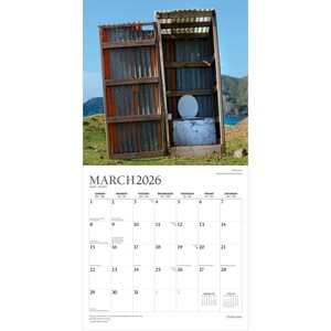 May include: A calendar page for March 2026 featuring a rustic outhouse with a corrugated metal roof and walls. The outhouse door is open, revealing a white toilet. The calendar grid is below the image.
