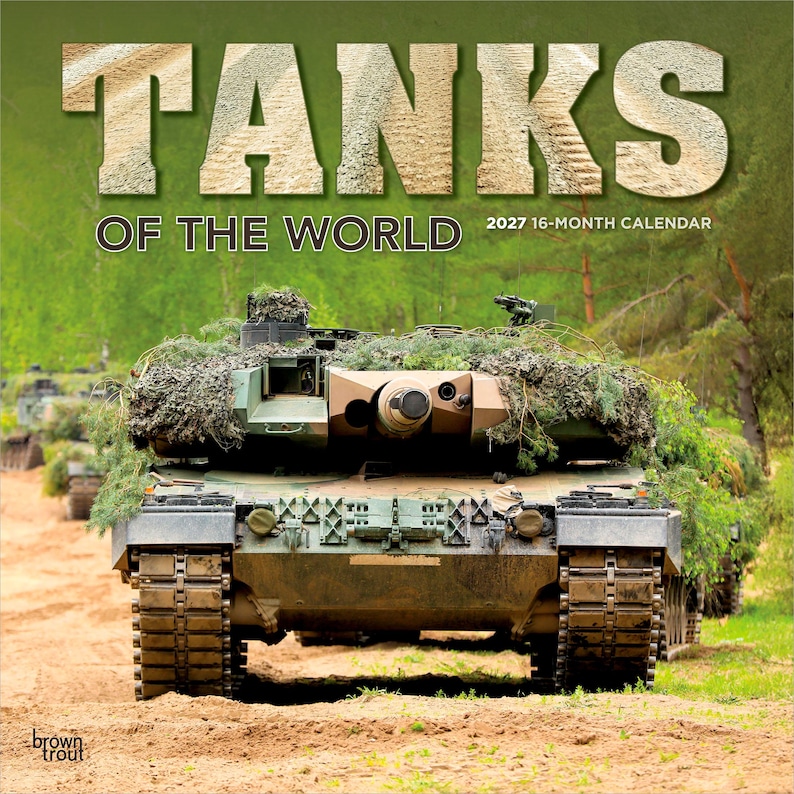 Puede incluir: Un calendario de 16 meses para 2027 titulado TANKS OF THE WORLD que muestra una vista frontal de un tanque militar camuflado cubierto de follaje. El tanque se encuentra en un camino de tierra con &aacute;rboles verdes al fondo.