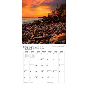 May include: A 2027 wall calendar for the month of September featuring a photograph of a rocky coastline at sunset with orange and yellow skies. The calendar grid displays the days of the month with text labels for September and the year 2027.