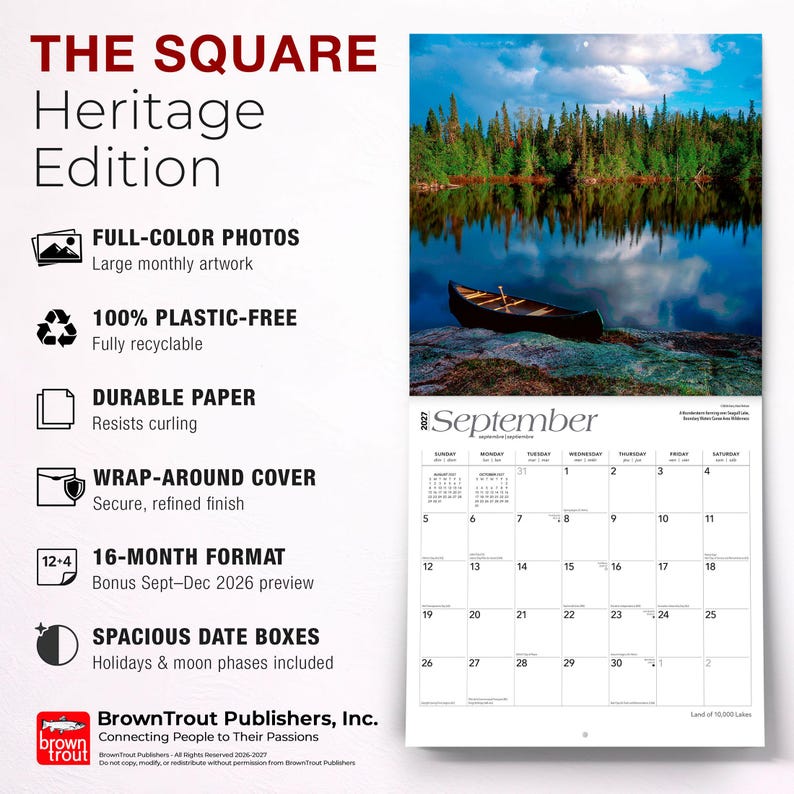 May include: The Square Heritage Edition 2027 wall calendar features a full-color photograph of a canoe on a lake with a forest backdrop. The calendar includes a September 2027 grid with spacious date boxes, holidays, and moon phases, printed on durable paper.