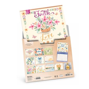 May include: A 2027 wall calendar titled Faith with a watercolour floral cover illustration. The back panel displays twelve monthly calendar pages featuring various floral and nature-themed designs, inspirational text, and a small preview of April.