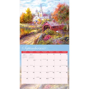 May include: A wall calendar page for September 2027 featuring a painting of a red covered bridge and a white church with a steeple surrounded by autumn trees and colourful flowers. The grid displays the days of the month with red headers.