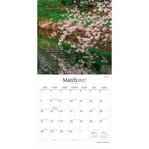 May include: A wall calendar for March 2027 featuring a photograph of pink cherry blossoms hanging over a dark green pond. The text reads: When we heal the earth, we heal ourselves. The calendar grid displays the days of the month clearly.