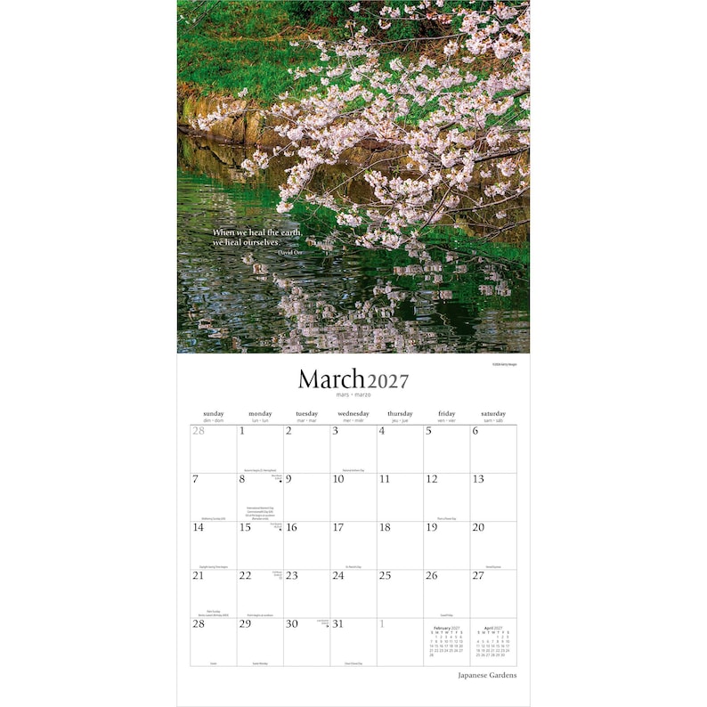 May include: A wall calendar for March 2027 featuring a photograph of pink cherry blossoms hanging over a dark green pond. The text reads: When we heal the earth, we heal ourselves. The calendar grid displays the days of the month clearly.
