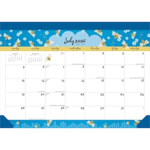 May include: A July 2026 calendar with a bee theme, featuring a blue border with bees and honeycomb patterns. The days of the week are across the top, with the month and year in a cloud-shaped design. Measurements are in centimeters.