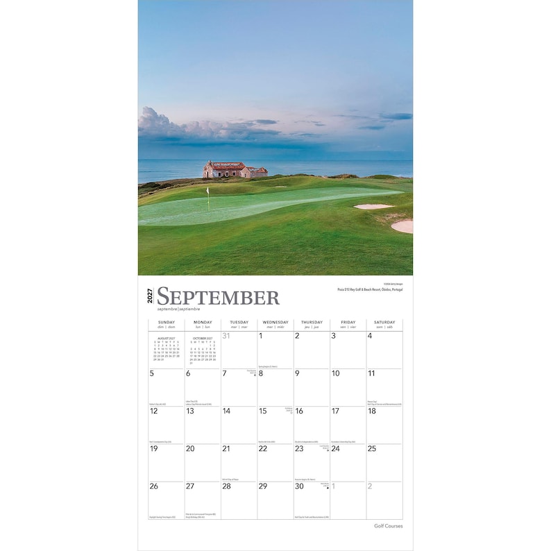 May include: A 2027 wall calendar for the month of September featuring a photograph of a green golf course by the ocean with a small building in the distance. The calendar grid displays the days of the month with black text on a white background.
