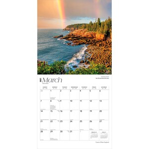 May include: A 2027 wall calendar for the month of March featuring a photograph of a rocky coastline at Acadia National Park. The image displays a vibrant rainbow over the ocean, cliffs, and evergreen trees, with a grid for daily scheduling.