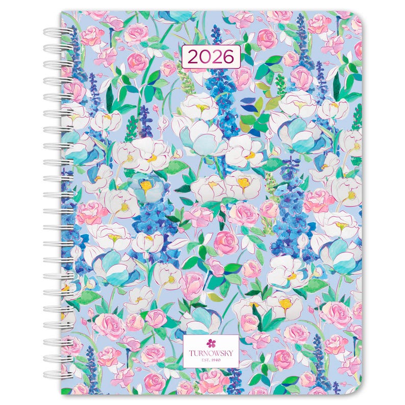 May include: A spiral-bound planner with a floral design. The cover features a light blue background with watercolor-style flowers in white, pink, and blue. The year "2026" is displayed in a rectangular box. The Turnowsky logo is at the bottom.