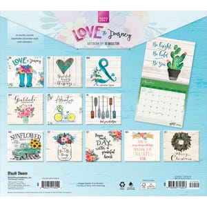 May include: A 2027 wall calendar titled Love the Journey with artwork by Jo Moulton. It features twelve monthly pages with floral, rustic, and inspirational designs, including a cactus, bicycle, and truck, plus a grid for scheduling dates.