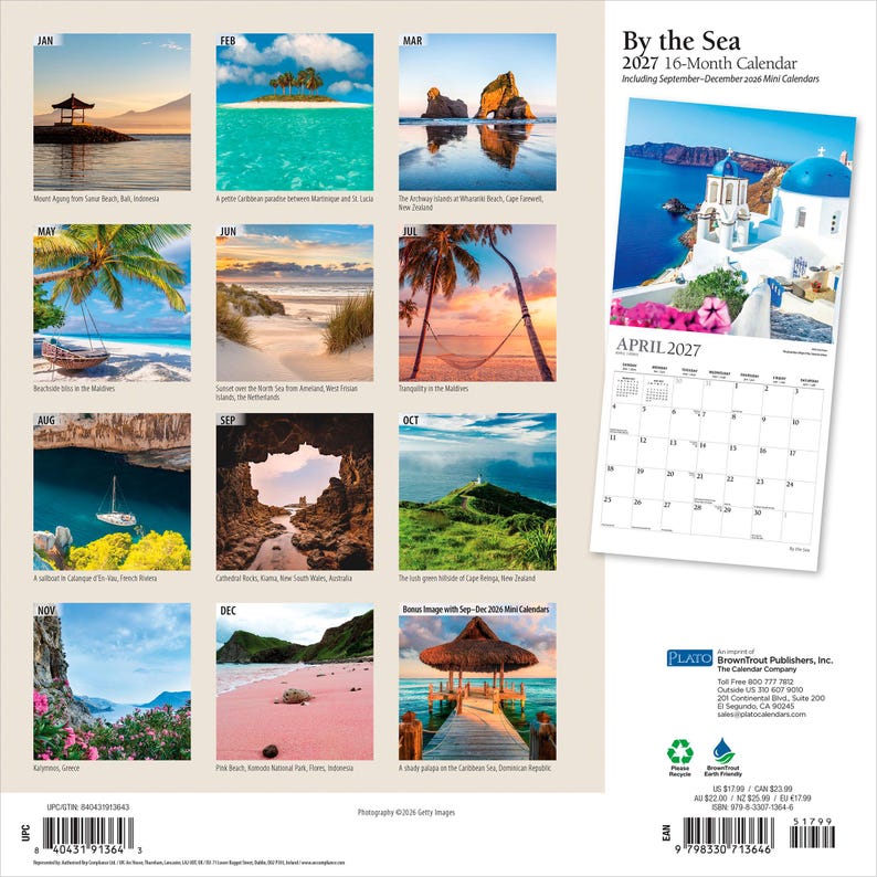 May include: A 2027 16-month wall calendar titled By the Sea, featuring twelve monthly landscape photographs of coastal scenes, including beaches, islands, and rock formations, with a larger view of a Greek island village for the month of April.