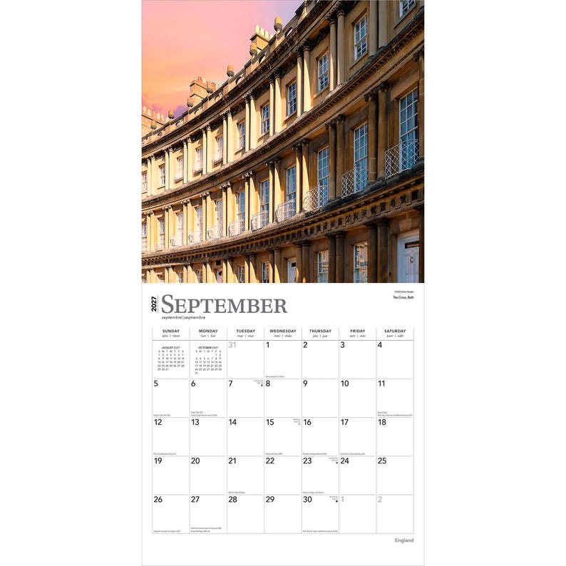 May include: A 2027 wall calendar page for September featuring a photograph of the curved stone architecture of The Circus in Bath, England, under a sunset sky. The calendar grid displays the days of the month with black text on a white background.