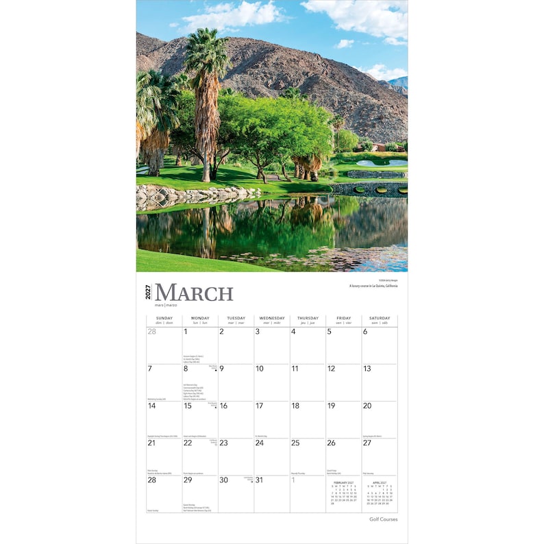 May include: A 2027 wall calendar for the month of March featuring a scenic photograph of a golf course with a pond, palm trees, and mountains. The calendar grid displays the days of the month, including small reference calendars for February and April.