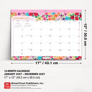 May include: A 12-month wall calendar for January 2027 through December 2027, measuring 17 inches by 12 inches. The calendar features a colorful floral border at the top and bottom, with a grid layout for January 2027 and BrownTrout branding.