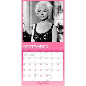 May include: A wall calendar for September 2027 featuring a black and white portrait of Marilyn Monroe at the top. The calendar grid displays the month name, year, and dates in a pink and white layout with the signature Marilyn Monroe at the bottom.